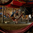 In the circular communal dwelling of the Yanomami, all of the 120 village inhabitants sleep in hammocks under the same roof. (Photo: Rainforest Foundation Norway / ISA Brazil)
